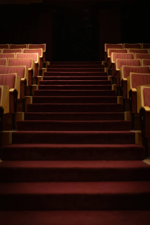 rows of seats facing the front door of a theater