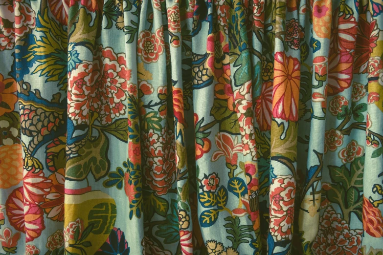 the curtains are showing colorful flower patterns