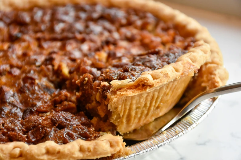 the pie has a fork resting next to it