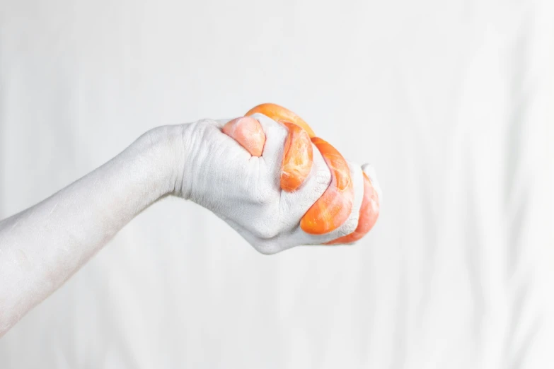 someone is holding onto a fake carrot for a selfie