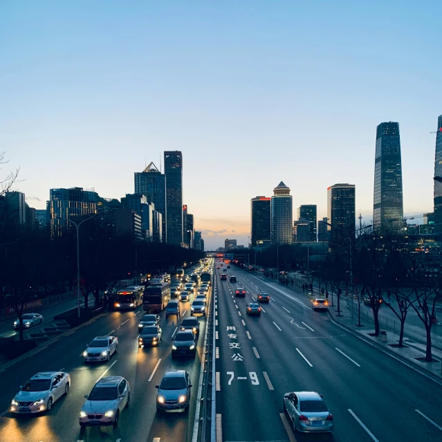 a city filled with lots of traffic on a street