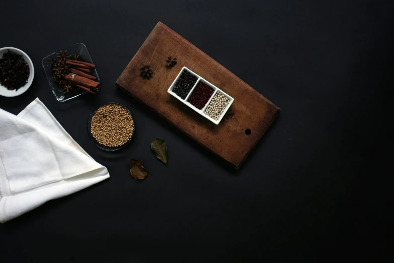 there are various spices, a matchbox and napkins on the table