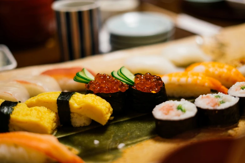 sushi is served on a wooden surface