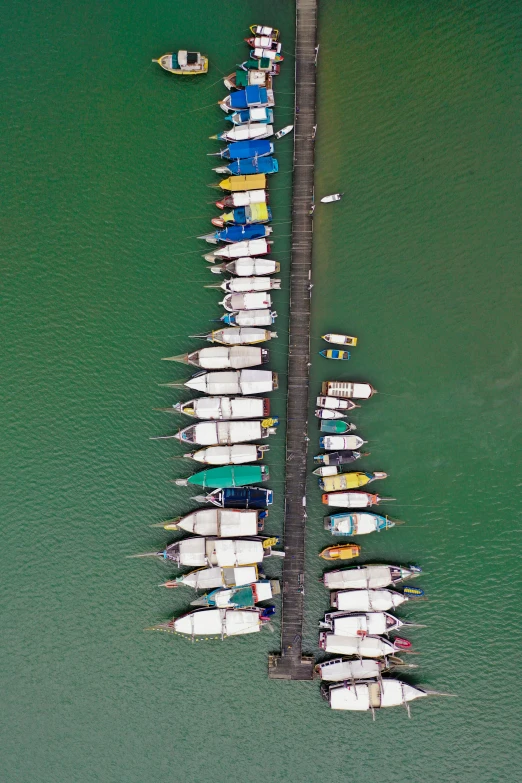 a view from above of a boat dock filled with boats