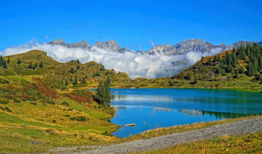 a blue mountain lake surrounded by mountains