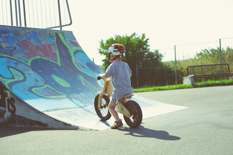 a  riding on the back of a bicycle