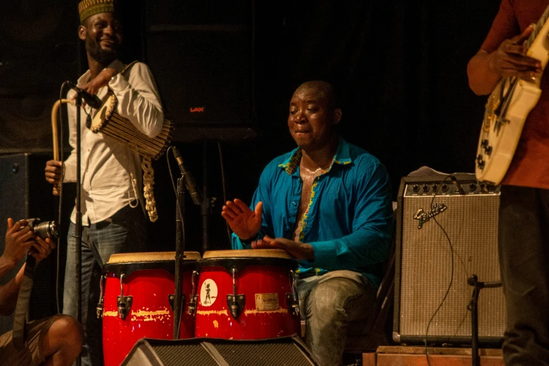 a group of men playing musical instruments at night