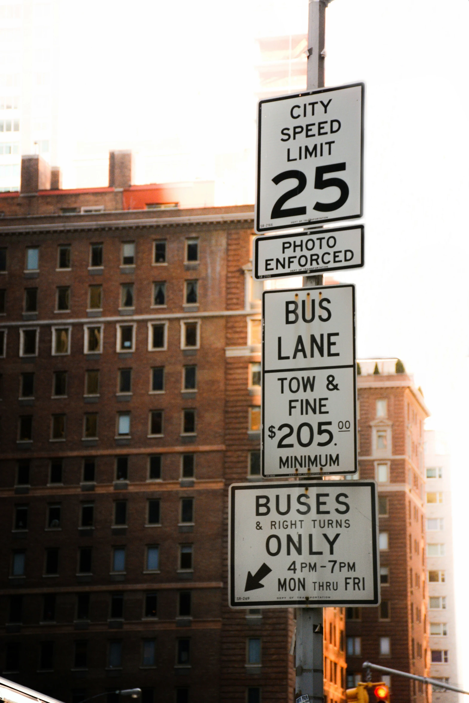 a street sign near a big city building