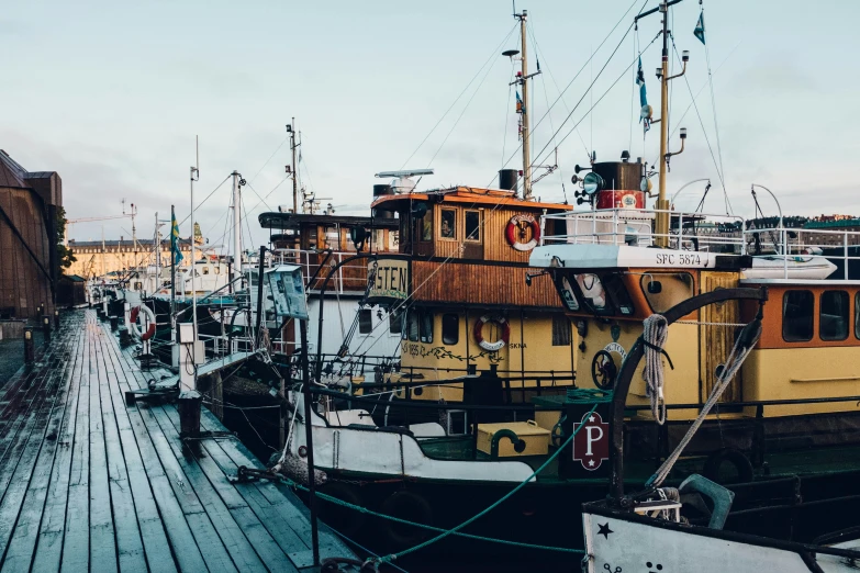 a dock filled with lots of small boats