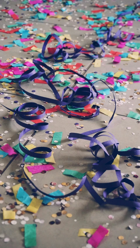 streamers and confetti sit on the ground