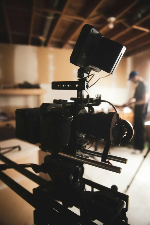 a camera sitting on top of a tripod in a garage