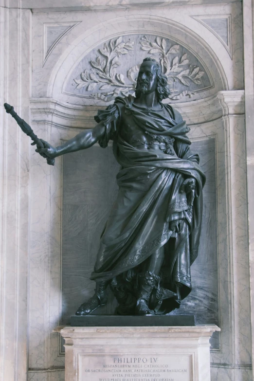 the statue of an african american warrior is standing in a courtyard