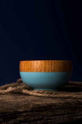 a bowl sitting on top of a wooden table