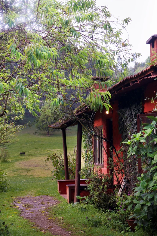 a dirt path running along side of a home