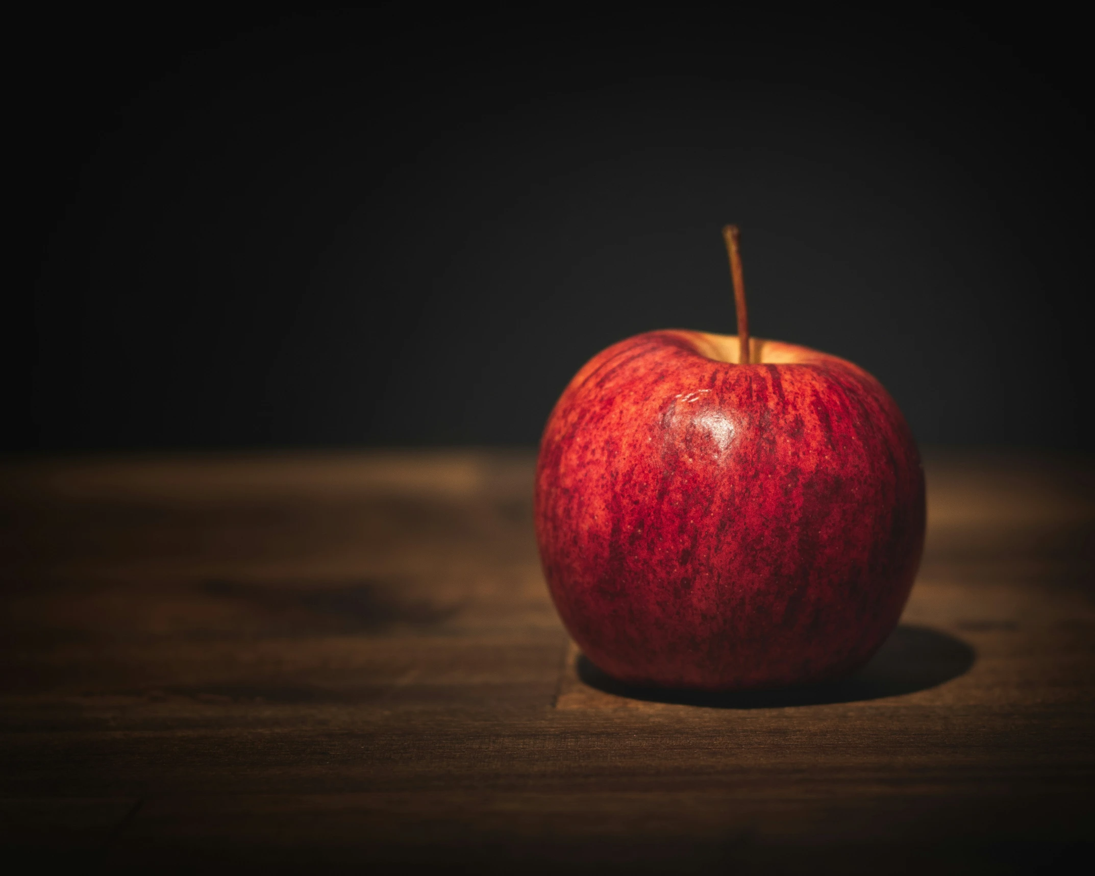 red apple with shadow from its core