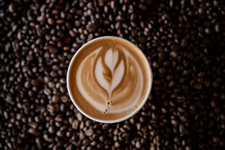 a cup with coffee in it is on a table