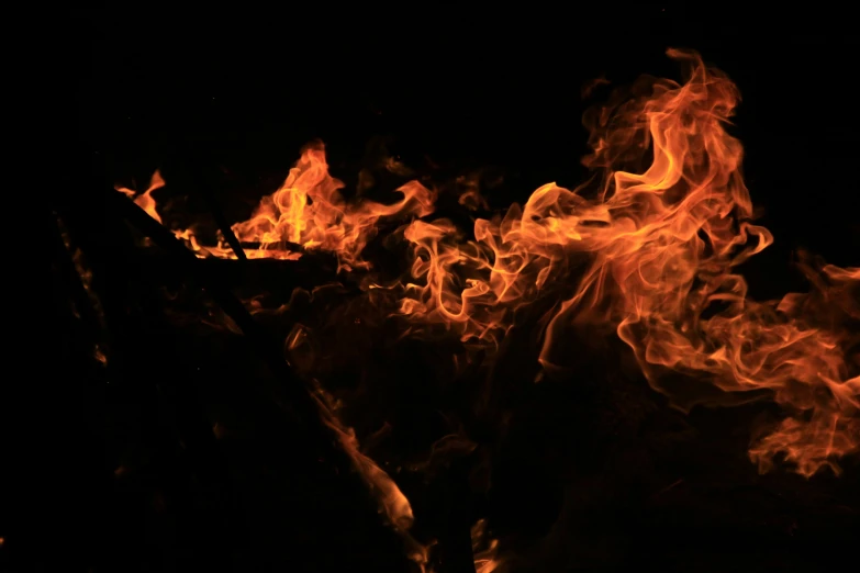 flames on a black background that are brightly colored