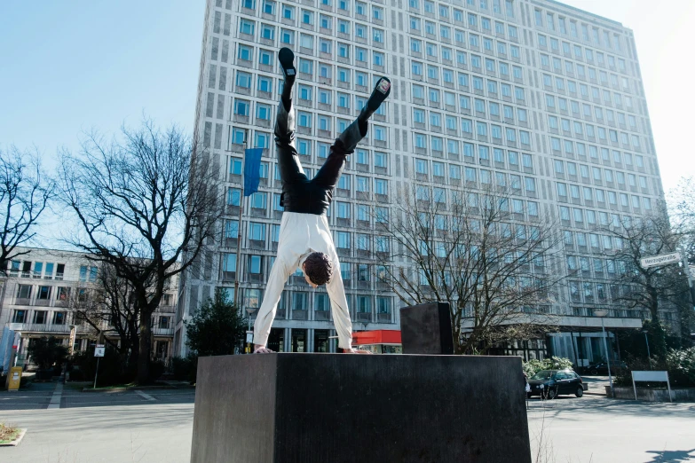 a statue in front of a building on a sunny day