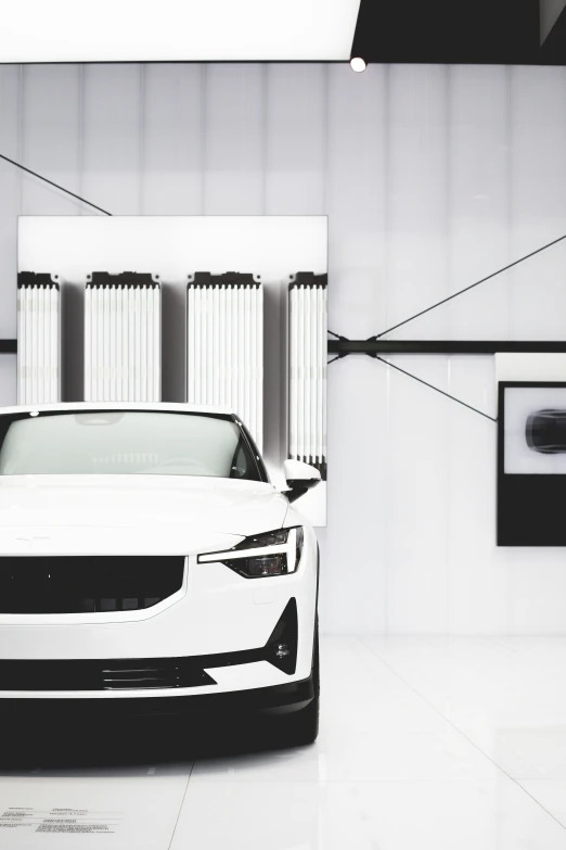 a car is shown in an all - white room