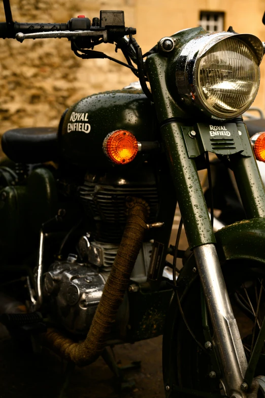 this is an old green bike with a license plate