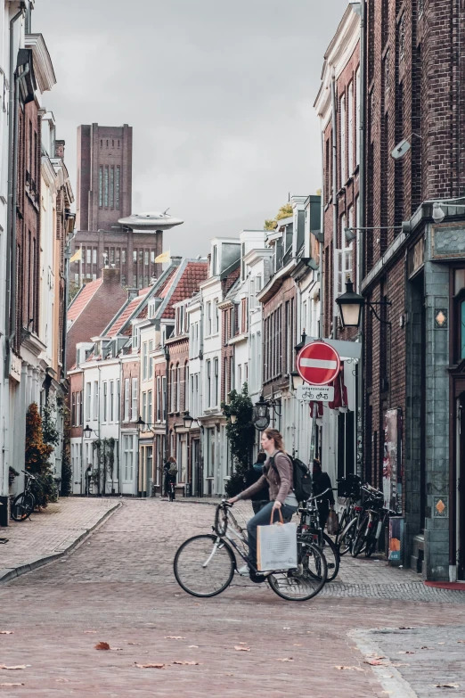 a man riding a bike in an urban setting