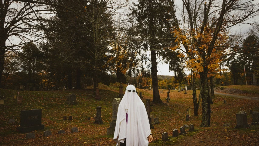 a halloween themed grave in the woods