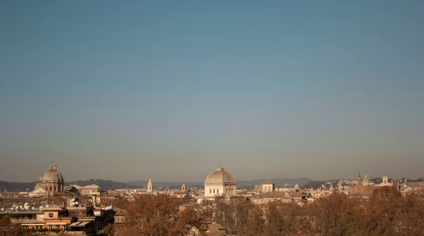 a view of a city with some towers in the distance