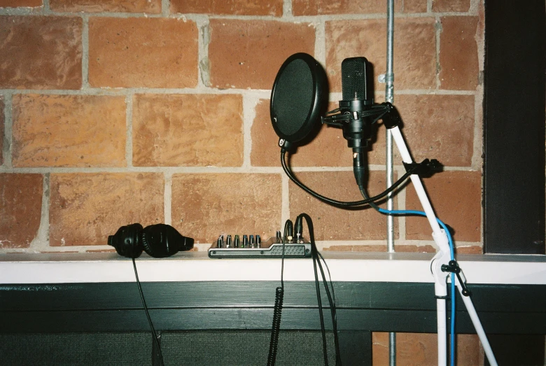 a microphone, some music supplies, and an antenna sit on a counter