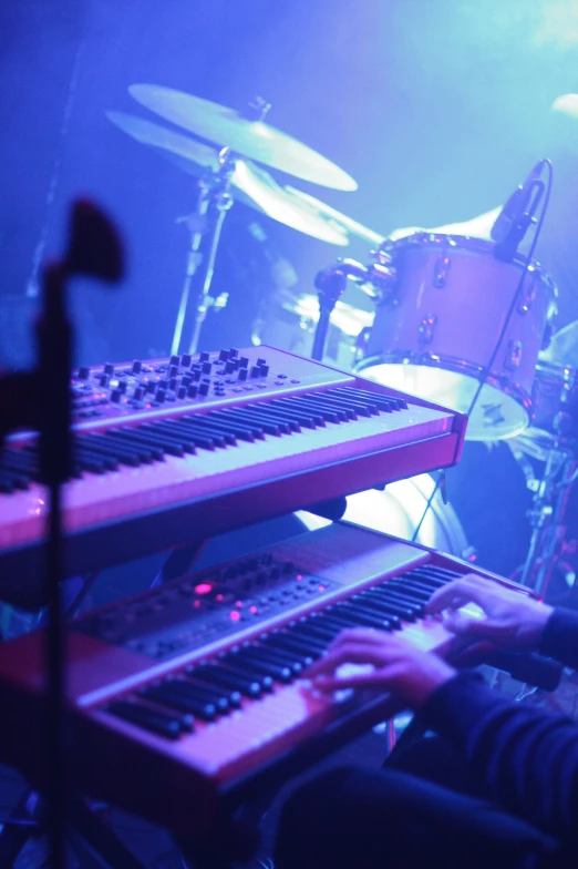 the band is playing on drums in the stage