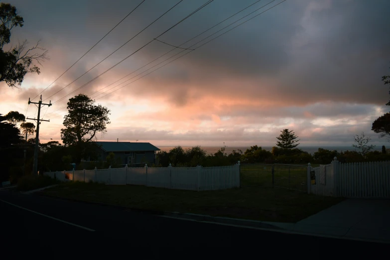 there is a cloudy sky and a street view