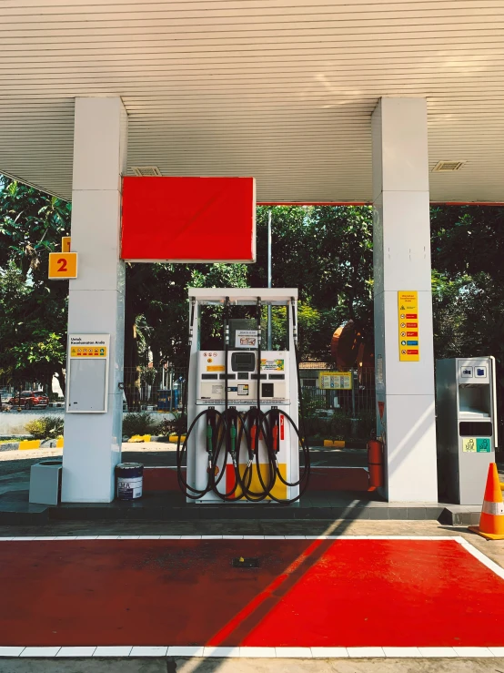 the service station has several gas pumps to the side