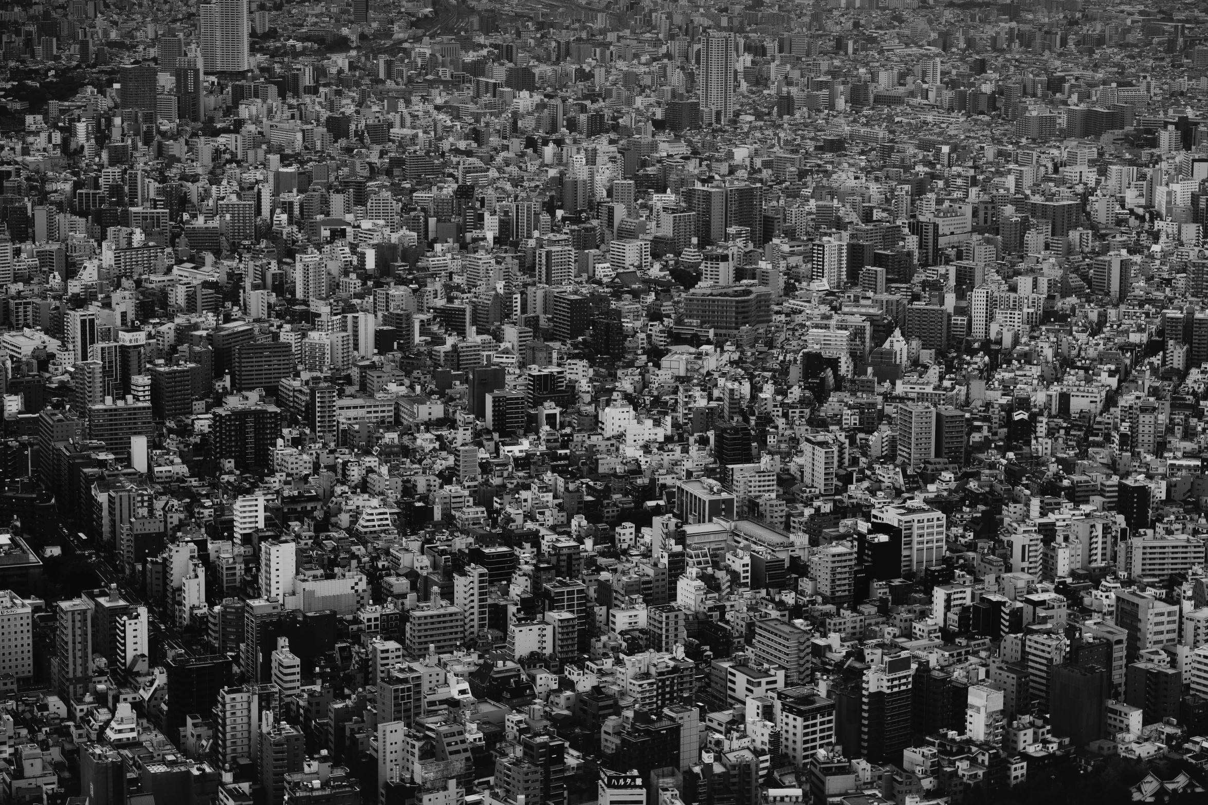 black and white pograph of a cityscape taken from an airplane