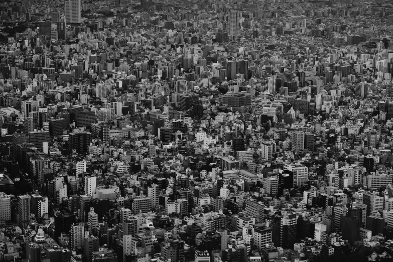 black and white pograph of a cityscape taken from an airplane