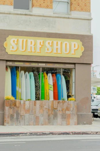 there is a store with several surf boards on display