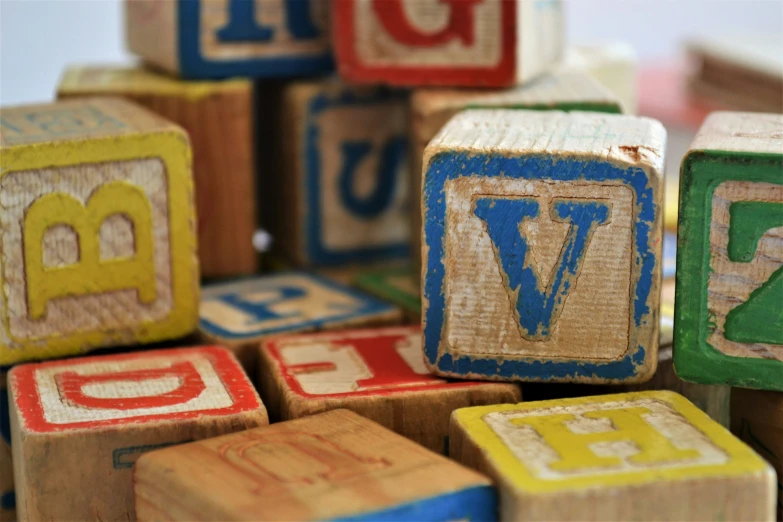 a closeup view of toy blocks, made from children's wooden letters