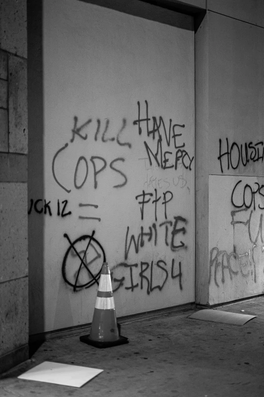 a black and white po of graffiti on the wall