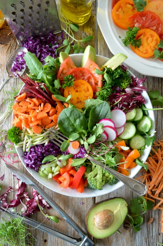 a white bowl filled with vegetables and some dressing