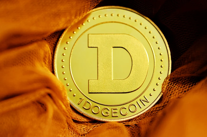 close up image of a golden d token coin