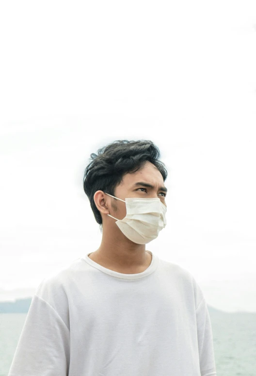 a person standing with a mask on