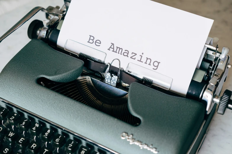 an old typewriter has been left with a card on it