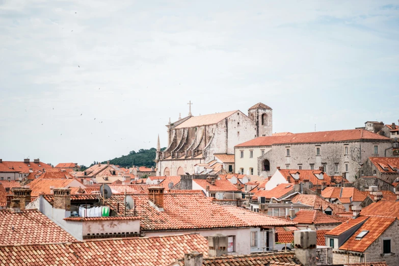 many buildings with orange roof tops in a city