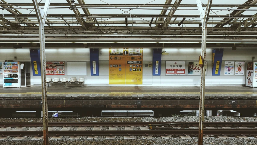 a subway station in japan with graffiti on the wall