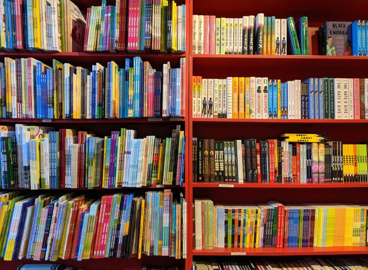 several shelves of books, all in various colors