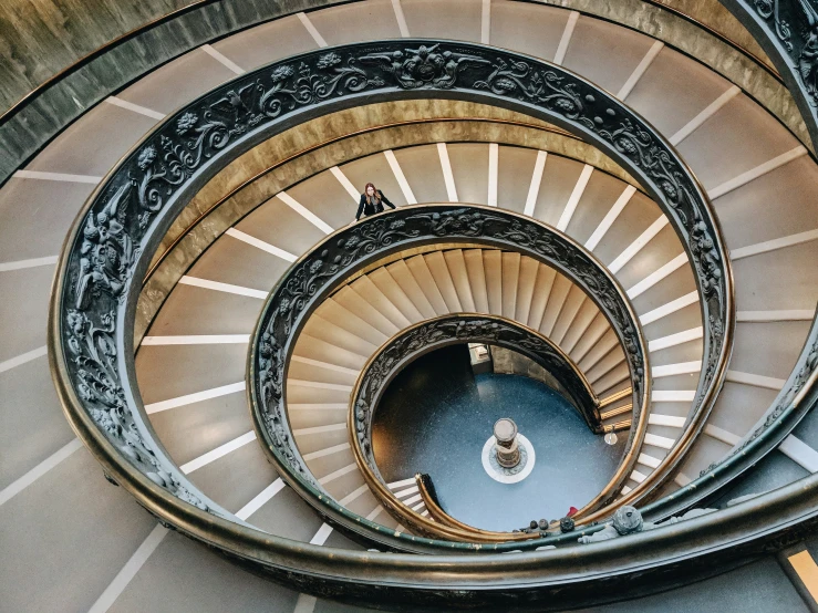 spiral stair stairs in a building looking up