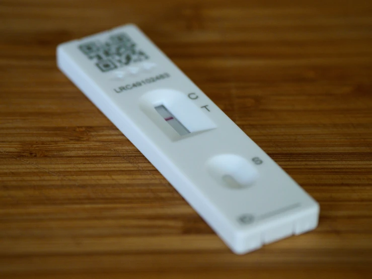 a close up of a wii remote on a table