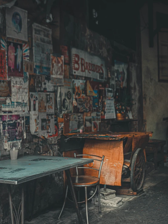 two chairs and an old table in an abandoned building