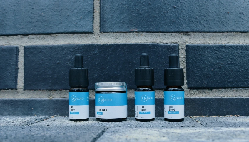 three different types of cbd sitting on the sidewalk