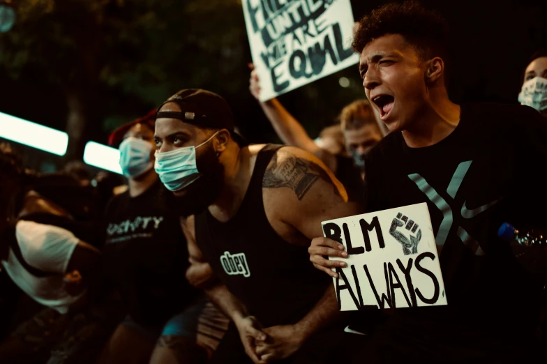 there are people marching with masks on their face