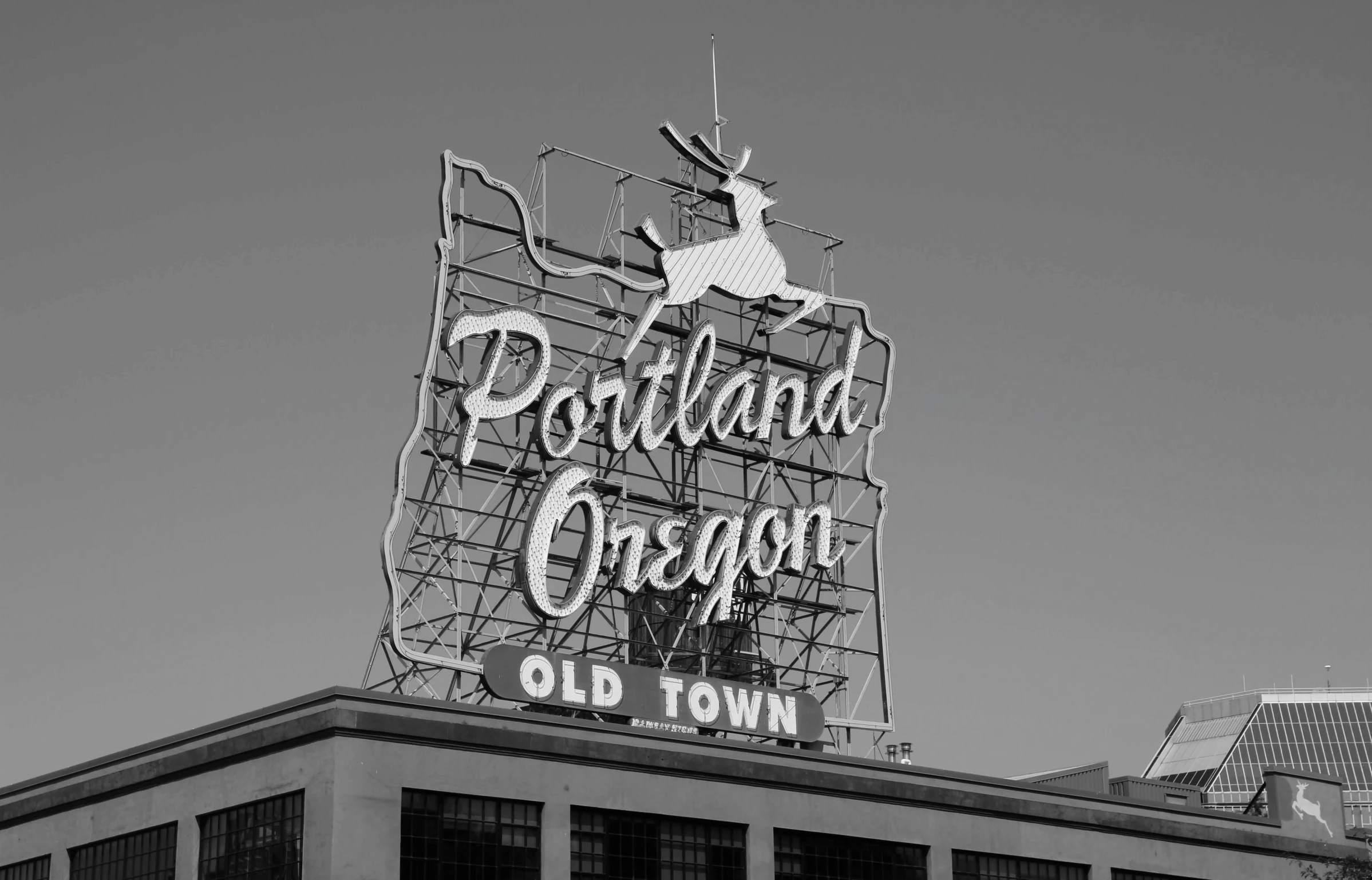 an old town sign in black and white