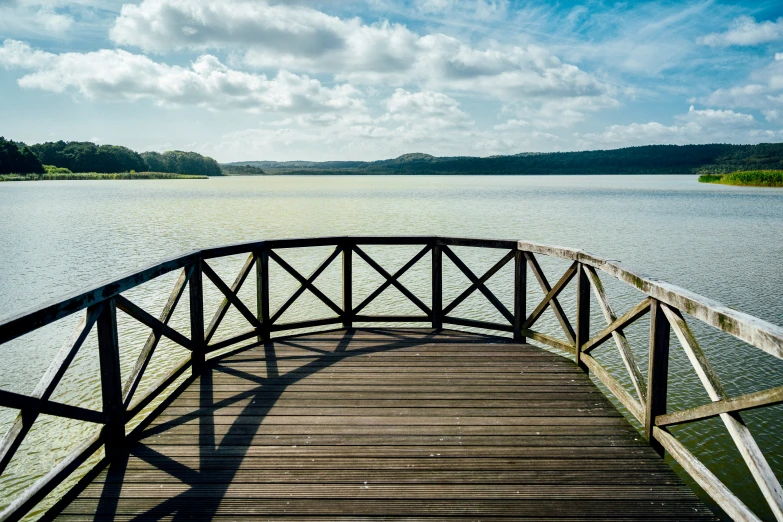 a pier is on the edge of a lake